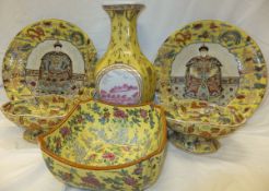 A collection of modern Chinese famille jaune china wares to include two chargers,