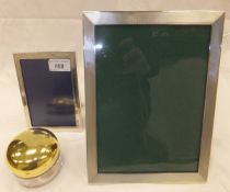 A late 20th Century Asprey silver photograph frame, together with a further silver photograph