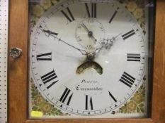 A Victorian oak cased long case clock, the 30 hour movement with painted enamel dial, the chapter