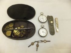 A box containing two white metal pocket watches,