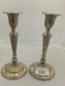 A pair of Edwardian silver candlesticks of fluted form (London, 1901) CONDITION REPORTS Both