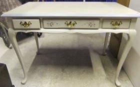 A 'Jasper' cream painted dressing table with three frieze drawers,