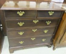 A 19th Century mahogany square fronted chest of two short over three long graduated drawers to