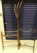 A pair of turned beech and glass rod mounted towel rails,