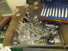 A box of assorted plated wares to include entree dishes, a pair of three branch candelabra,