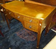 An Edwardian mahogany and satinwood banded Sheraton Revival bow fronted sideboard or dressing table,