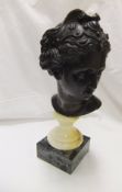 A bronze bust of a woman in the Classical manner, raised on a pedestal base CONDITION REPORTS Some