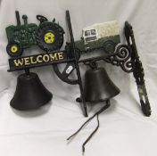 Two iron bells, one bracket decorated with tractor inscribed "Welcome", the other with a Land Rover,