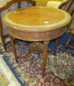 WITHDRAWN A circular mahogany centre table with painted top with carved and applied moulding to