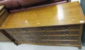 A reproduction yew wood chest,