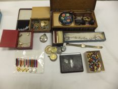A box containing assorted costume jewellery, commemorative coinage, a silver pocket watch,