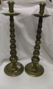 A pair of 19th Century altar type brass candlesticks