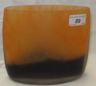 A Taru Syrjanen glass vase decorated in orange and black