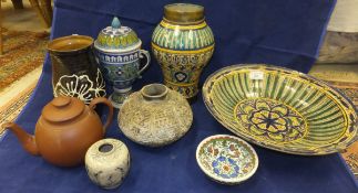 A collection of Iznik, Oriental, and Continental pottery to include a large footed bowl decorated in