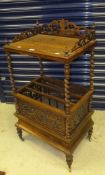 A Victorian rosewood canterbury with pierced gallery to a plain top and bobbin supports to a rack