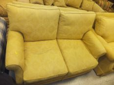 Two pale gold self patterned upholstered two seater sofas