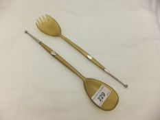 Two Scottish horn servers as spoon and fork,