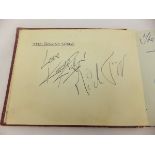 An autograph album containing signatures of Brian Jones, Keith Richards and Mick Jagger of The
