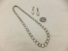 A moonstone necklace, together with a pair of earrings and a brooch CONDITION REPORTS Date is