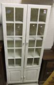 A white painted cabinet,