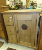 A Continental pine food cabinet with single door with vent and three drawers