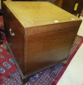 An early 19th Century mahogany and inlaid cellerette, the rising lid opening to reveal an interior