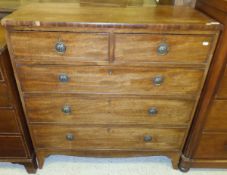 A Regency mahogany chest of two short and three long drawers with brass loop drop handles and brass