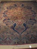 A Persian carpet, the central floral medallion on a blue and cream ground with all-over floral