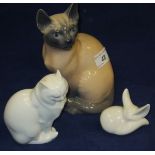 A Royal Copenhagen porcelain figure of a Siamese cat, model 3281, together with a Herend porcelain