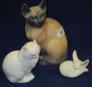 A Royal Copenhagen porcelain figure of a Siamese cat, model 3281, together with a Herend porcelain