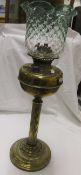 A late Victorian "Improved Marvel" lamp with green tinted glass shade,