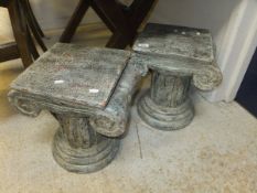 A pair of painted terracotta tables or stools in the form of Ionic column caps