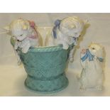 A figure group modelled as two kittens peering from a basket, retailed by T Goode & Co.