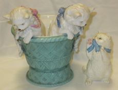 A figure group modelled as two kittens peering from a basket, retailed by T Goode & Co.