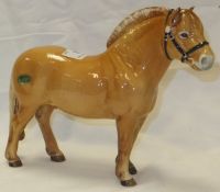 A Beswick pottery figure of a Norwegian forge horse CONDITION REPORTS Has general wear and tear