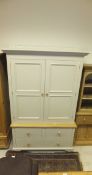 A modern painted and stained beech cupboard,