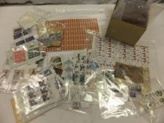 A box of assorted stamps to include un-used 1966 World Cup Winners stamps,