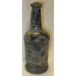 A circa 1800 black glass wine bottle