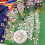 A collection of glassware to include various 19th Century and later cut glass decanters,