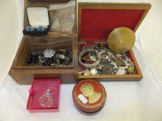 Two inlaid wooden boxes containing various costume jewellery to include necklaces,  brooches,