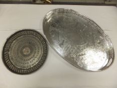 A silver plated twin-handled galleried drink's tray together with a Middle Eastern style tray