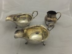 A pair of George V silver sauceboats (by Alexander Clarke & Company, Birmingham, 1934), together