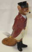 A Royal Doulton porcelain figure of a fox dressed as a huntsman wearing hunting pinks and black top