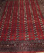 A Bokhara carpet, the repeating elephant foot medallions in cream, eau de nil,