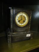 A 19th Century French slate and marble cased mantel clock,
