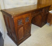 A Victorian oak sideboard with central drawer and two cupboard doors on a plinth base