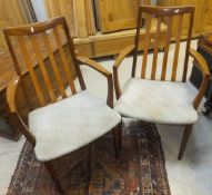 A set of six G-Plan teak slat back dining chairs (4 + 2)