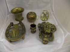 A box of various brassware including Classical style face mask door knocker, small mortar,