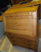 A pine bureau of four drawers,