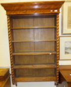 A late 19th Century satin birch wood hanging shelf unit, the shaped cornice above various shelves,